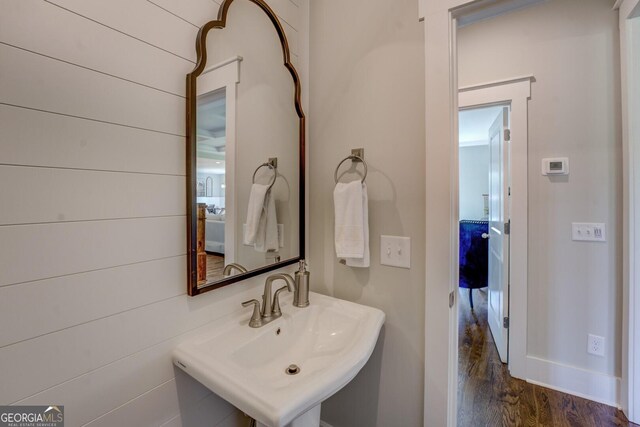 3076 E Lake Rd, Mcdonough, GA 30252 - bathroom featuring a sink and wood finished floors