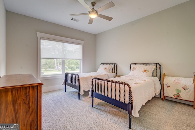 3076 E Lake Rd, Mcdonough, GA 30252 - bedroom featuring light colored carpet and ceiling fan