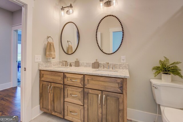 3076 E Lake Rd, Mcdonough, GA 30252 - bathroom with double vanity and wood finished floors