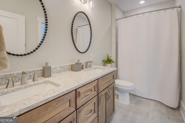 3076 E Lake Rd, Mcdonough, GA 30252 - full bathroom featuring double vanity, recessed lighting, and a shower with shower curtain