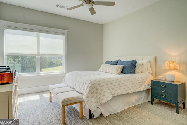 3076 E Lake Rd, Mcdonough, GA 30252 - bedroom with light colored carpet and a ceiling fan