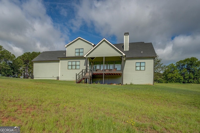3076 E Lake Rd, Mcdonough, GA 30252 - rear view of property featuring a lawn and a chimney