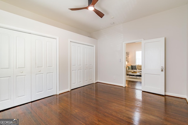 496 Rankin St NE, Atlanta, GA 30308 - unfurnished bedroom with two closets, wood finished floors, and ceiling fan