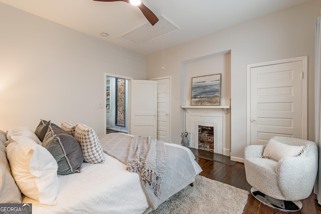 496 Rankin St NE, Atlanta, GA 30308 - bedroom featuring attic access, dark wood-type flooring, a fireplace, and ceiling fan