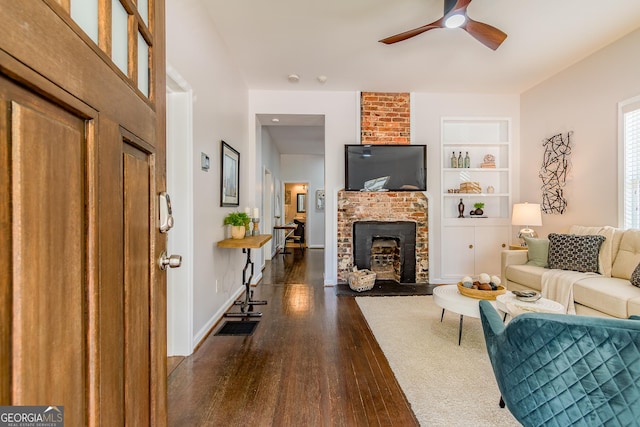 496 Rankin St NE, Atlanta, GA 30308 - living room with wood finished floors, a ceiling fan, a fireplace, and built in shelves