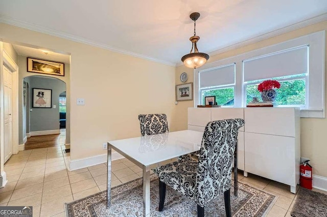 1134 Jefferson Ave, East Point, GA 30344 - dining space with crown molding, arched walkways, and light tile patterned floors