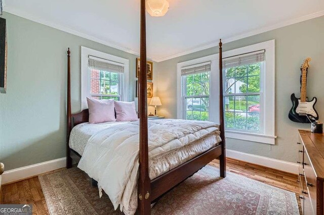 1134 Jefferson Ave, East Point, GA 30344 - bedroom with ornamental molding and wood finished floors