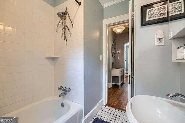 1134 Jefferson Ave, East Point, GA 30344 - bathroom featuring bathing tub / shower combination, ornamental molding, and a textured wall