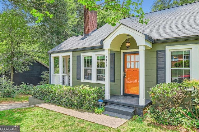 1134 Jefferson Ave, East Point, GA 30344 - entrance to property with a chimney and a shingled roof