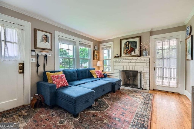 1134 Jefferson Ave, East Point, GA 30344 - living area featuring crown molding, a brick fireplace, and wood finished floors