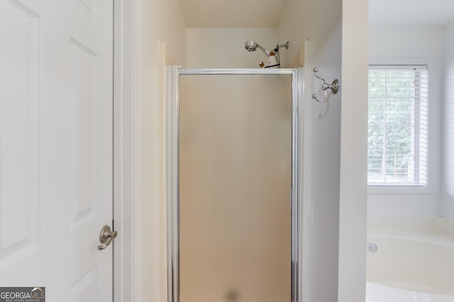 1406 Marshview Ct, Hoschton, GA 30548 - bathroom with a stall shower, healthy amount of natural light, and a bath