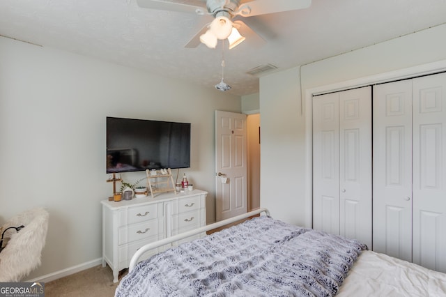 1406 Marshview Ct, Hoschton, GA 30548 - bedroom with carpet floors, a closet, and a ceiling fan