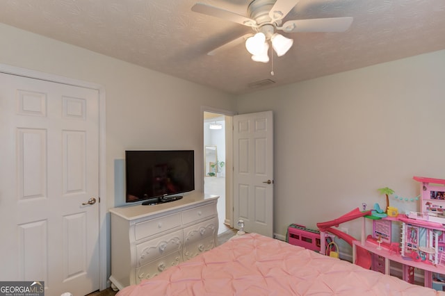 1406 Marshview Ct, Hoschton, GA 30548 - bedroom with ceiling fan and a textured ceiling