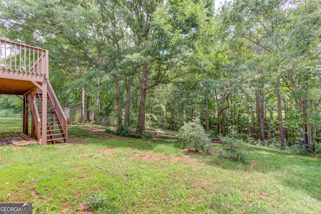 1406 Marshview Ct, Hoschton, GA 30548 - view of green lawn with stairs and a wooden deck