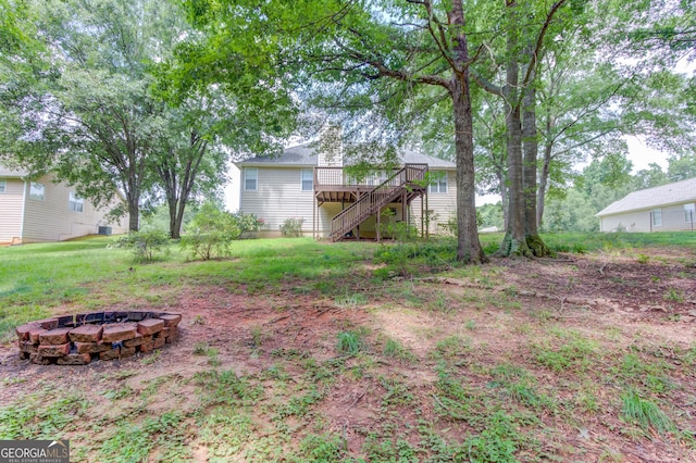 1406 Marshview Ct, Hoschton, GA 30548 - view of yard with an outdoor fire pit, stairs, and a deck