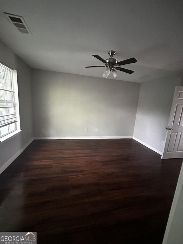 11313 Michelle Way, Hampton, GA 30228 - spare room featuring dark wood-style floors and a ceiling fan