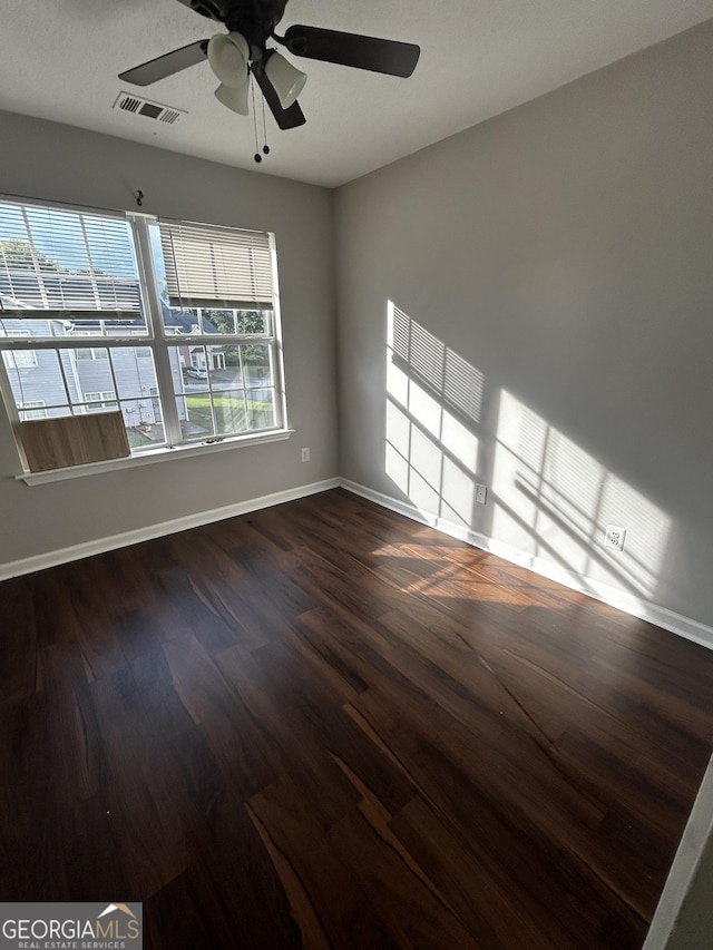 11313 Michelle Way, Hampton, GA 30228 - unfurnished room featuring dark wood-type flooring and ceiling fan