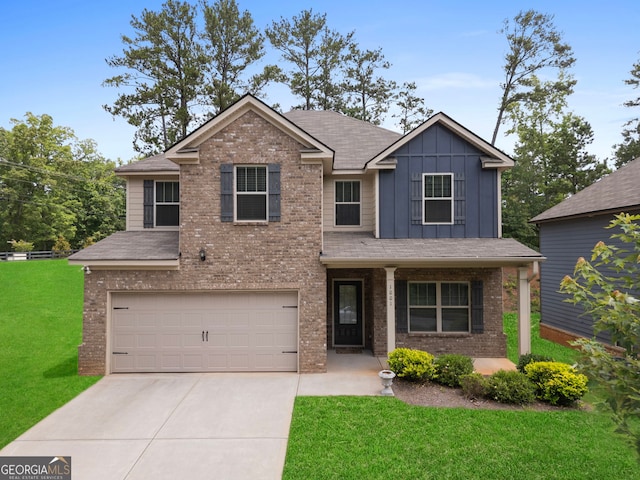 1001 Hartwell Rd, Locust Grove, GA 30248 - view of front of property featuring a garage, board and batten siding, brick siding, a front lawn, and concrete driveway