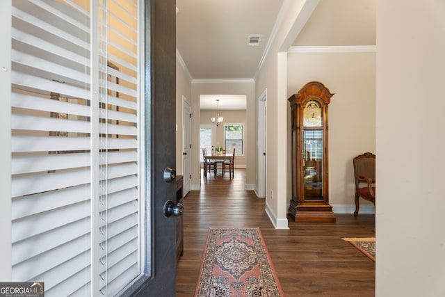 1001 Hartwell Rd, Locust Grove, GA 30248 - foyer with ornamental molding, dark wood-type flooring, and a chandelier