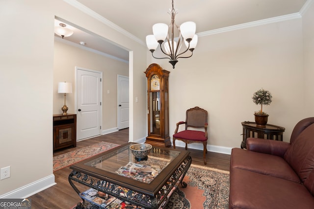 1001 Hartwell Rd, Locust Grove, GA 30248 - living room featuring wood finished floors, crown molding, and a chandelier
