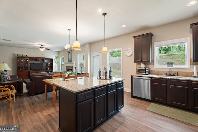 1001 Hartwell Rd, Locust Grove, GA 30248 - kitchen with stainless steel dishwasher, dark wood-style flooring, ceiling fan, a fireplace, and recessed lighting