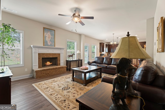 1001 Hartwell Rd, Locust Grove, GA 30248 - living area with a ceiling fan, wood finished floors, a brick fireplace, and recessed lighting