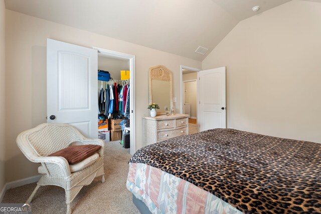 1001 Hartwell Rd, Locust Grove, GA 30248 - bedroom with light carpet, lofted ceiling, a spacious closet, and a closet