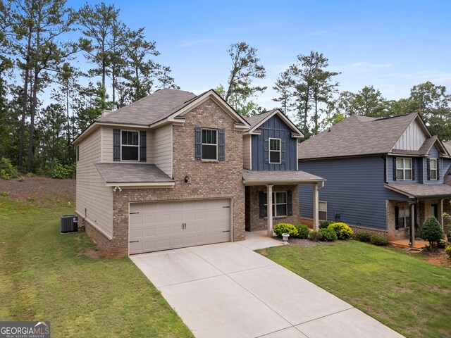 1001 Hartwell Rd, Locust Grove, GA 30248 - view of front facade with board and batten siding, brick siding, concrete driveway, and a front yard