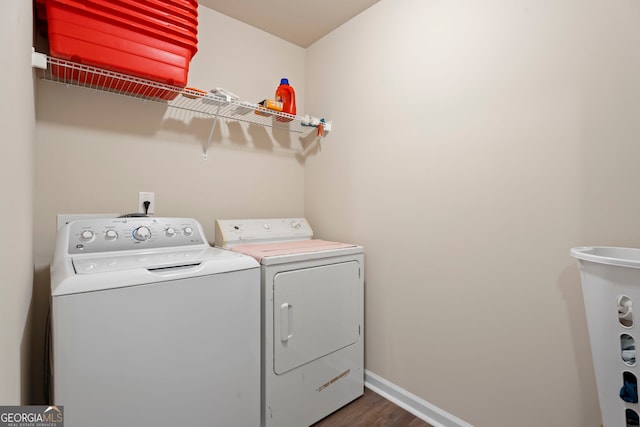1001 Hartwell Rd, Locust Grove, GA 30248 - laundry room featuring washing machine and clothes dryer and dark wood-type flooring