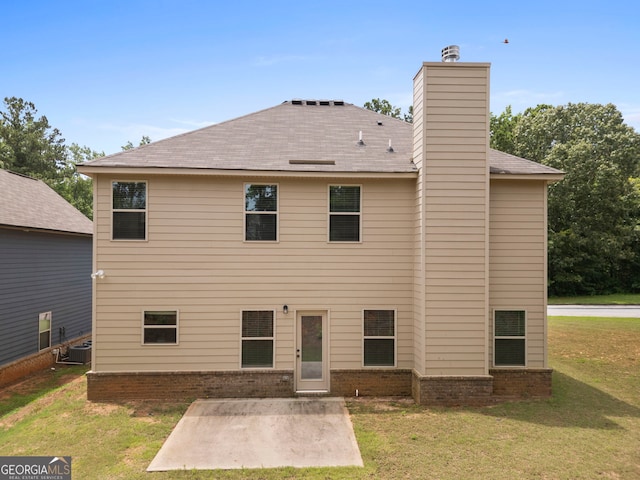 1001 Hartwell Rd, Locust Grove, GA 30248 - rear view of house featuring a patio, a lawn, a chimney, and brick siding