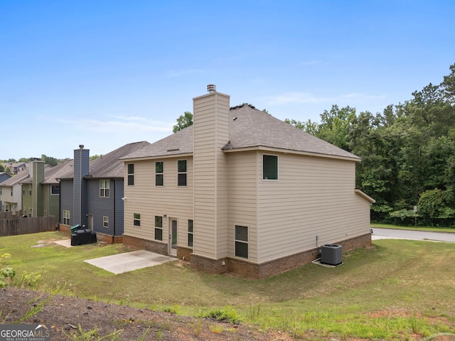 1001 Hartwell Rd, Locust Grove, GA 30248 - back of property featuring a patio area, a yard, roof with shingles, and a chimney