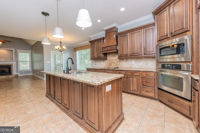 303 Sage Meadows Ln, Bonaire, GA 31005 - kitchen with stainless steel appliances, custom range hood, open floor plan, decorative backsplash, and light tile patterned flooring
