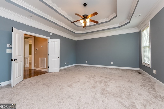 303 Sage Meadows Ln, Bonaire, GA 31005 - unfurnished room with carpet, a tray ceiling, ceiling fan, and ornamental molding
