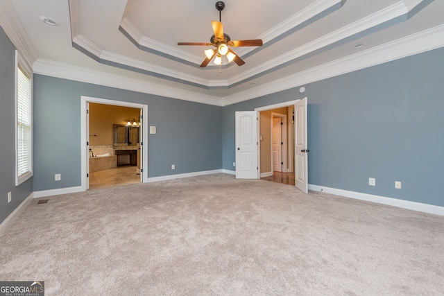303 Sage Meadows Ln, Bonaire, GA 31005 - unfurnished bedroom with a raised ceiling, carpet floors, crown molding, and ensuite bathroom