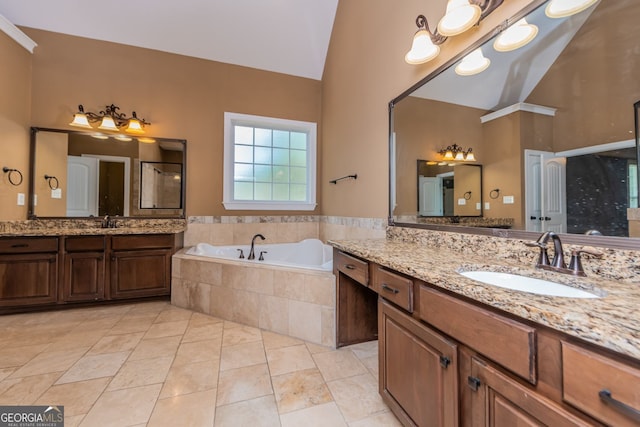 303 Sage Meadows Ln, Bonaire, GA 31005 - full bath featuring a shower stall, two vanities, a bath, high vaulted ceiling, and tile patterned floors