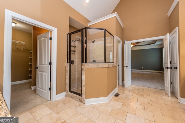 303 Sage Meadows Ln, Bonaire, GA 31005 - full bathroom with a spacious closet, a shower stall, and crown molding