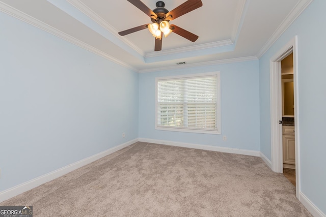 303 Sage Meadows Ln, Bonaire, GA 31005 - unfurnished bedroom with a raised ceiling, light colored carpet, crown molding, and a ceiling fan