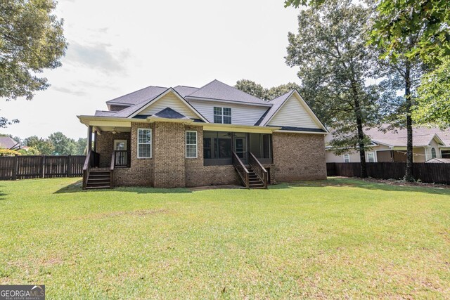 303 Sage Meadows Ln, Bonaire, GA 31005 - back of property with brick siding, a fenced backyard, a sunroom, stairs, and ceiling fan