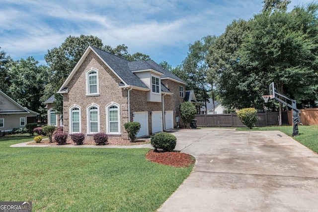 303 Sage Meadows Ln, Bonaire, GA 31005 - view of front of house featuring an attached garage, driveway, and brick siding