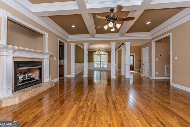 303 Sage Meadows Ln, Bonaire, GA 31005 - unfurnished living room with ornate columns, a ceiling fan, a fireplace, wood finished floors, and ornamental molding