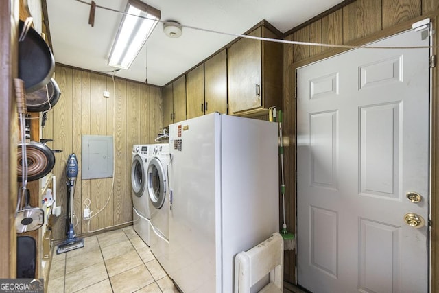 4782 Two Oak Dr, Macon, GA 31210 - laundry area with cabinet space, separate washer and dryer, wooden walls, electric panel, and light tile patterned flooring