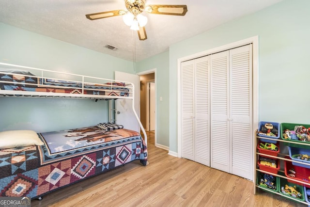 4782 Two Oak Dr, Macon, GA 31210 - bedroom with wood finished floors, a closet, and a ceiling fan