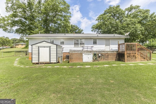 4782 Two Oak Dr, Macon, GA 31210 - back of house with a storage shed, stairs, and brick siding