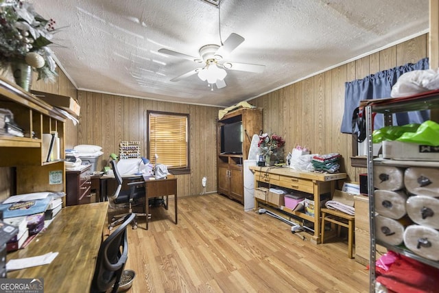 4782 Two Oak Dr, Macon, GA 31210 - office featuring wooden walls, wood finished floors, a ceiling fan, a textured ceiling, and crown molding