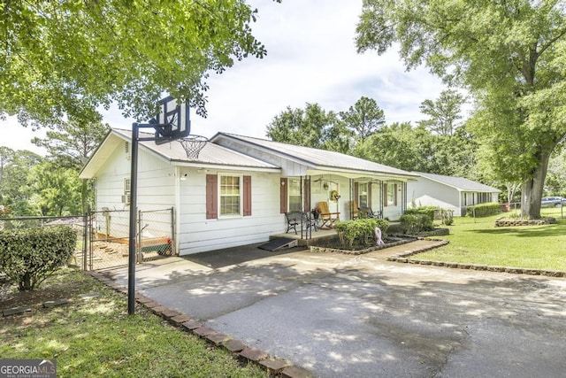 4782 Two Oak Dr, Macon, GA 31210 - ranch-style house with a porch, a gate, and a metal roof