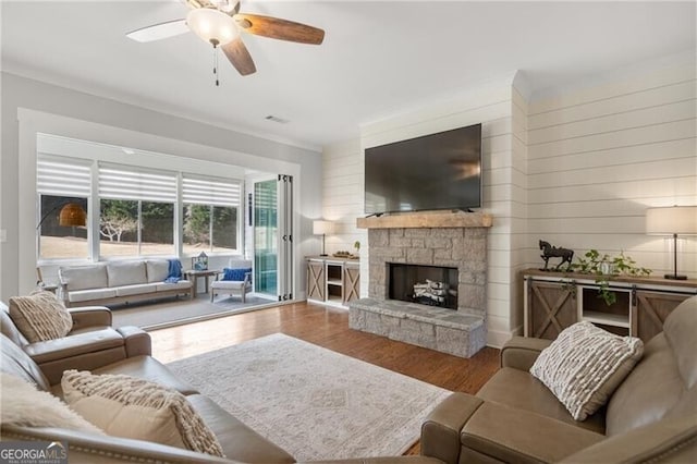 200 Ivy Meadow Way, Ball Ground, GA 30107 - living room featuring wood finished floors, ceiling fan, and a fireplace