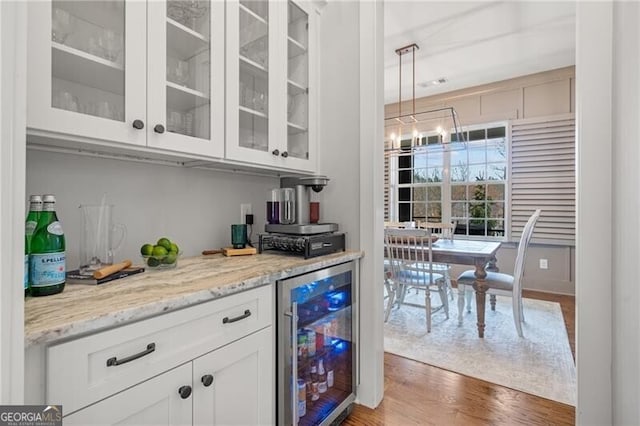 200 Ivy Meadow Way, Ball Ground, GA 30107 - bar with wine cooler, wood finished floors, and decorative light fixtures