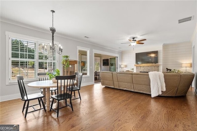 200 Ivy Meadow Way, Ball Ground, GA 30107 - dining space featuring ceiling fan, wood finished floors, a chandelier, and ornamental molding