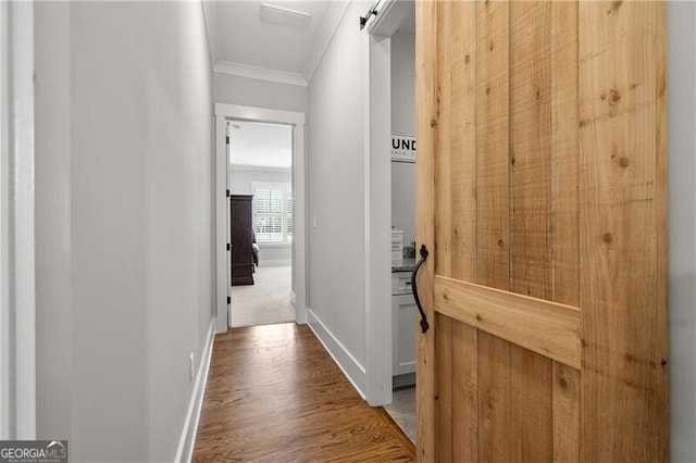 200 Ivy Meadow Way, Ball Ground, GA 30107 - hall with ornamental molding and wood finished floors