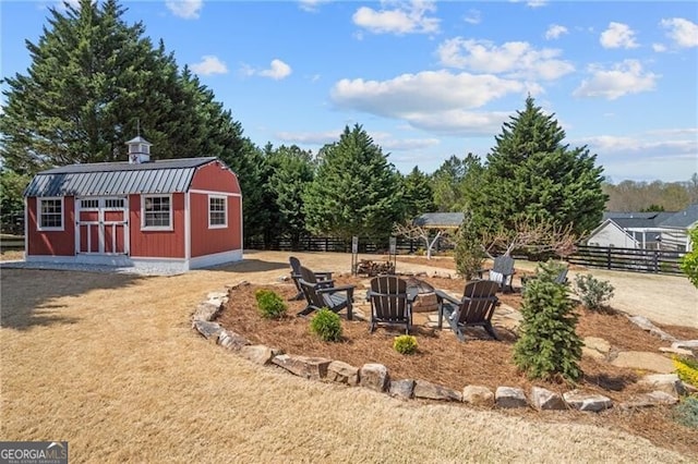 200 Ivy Meadow Way, Ball Ground, GA 30107 - view of yard featuring an outdoor fire pit and a storage unit